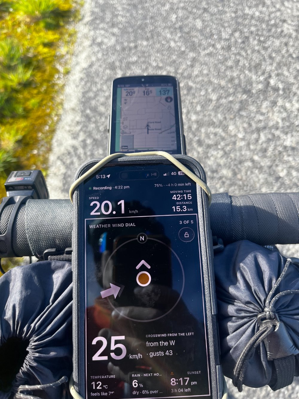 Secret Rides on Doug's handlebars mid-ride: the wind dial showing a 25 km/h crosswind from the left, gusts 43, at 20.1 km/h
